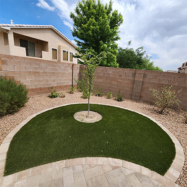 Artificial turf with paver border
