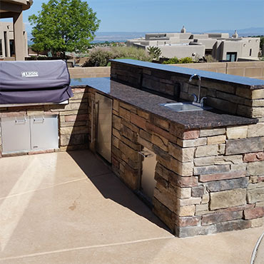 Outdoor kitchen with cultured stone finish. 