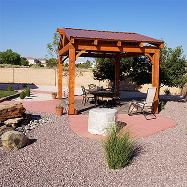 Southwestern style pergola with pro panel metal roofing.