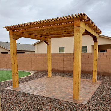 Southwestern style, roughcut lumber pergola/shade structure.